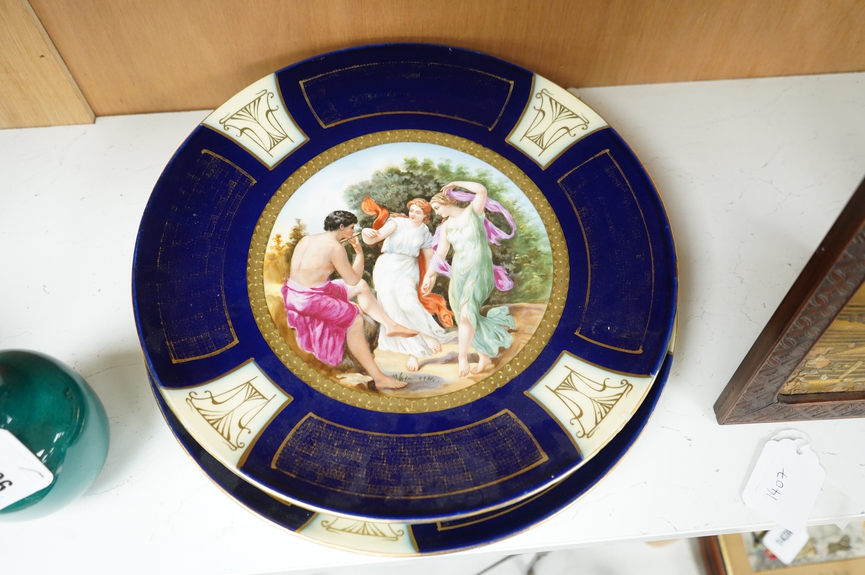 A pair of Vienna style porcelain chargers, early 20th century, 33cm